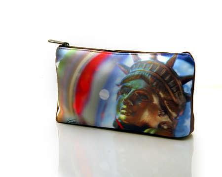 "Ms.Liberty" 
Cosmetic/clutch bag with zipper closure, interior attached key fob   10" x 5.5" x 1.75"- at base 6.5" 