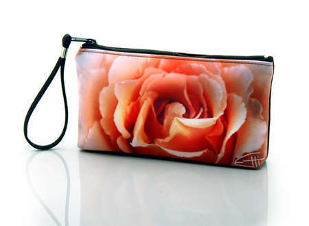 "Peach Rose"
Cosmetic/clutch bag with zipper closure, interior attached key fob   10" x 5.5" x 1.75"- at base 6.5" 