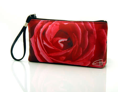 "Pink Rose"
Cosmetic/clutch bag with zipper closure, interior attached key fob   10" x 5.5" x 1.75"- at base 6.5" 
