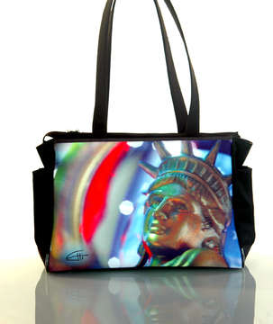 "Ms.Liberty" Tote Bag: Two elastic side bottle pockets, interior zipper pocket, zipper closure, water & stain resistant interior. 15.5" x 11" x 5" at base. 1" x 24" handles.