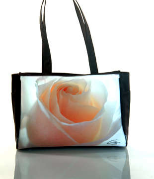 "White Rose"
Tote Bag: Two elastic side bottle pockets, interior zipper pocket, zipper closure, water & stain resistant interior. 15.5" x 11" x 5" at base. 1" x 24" handles