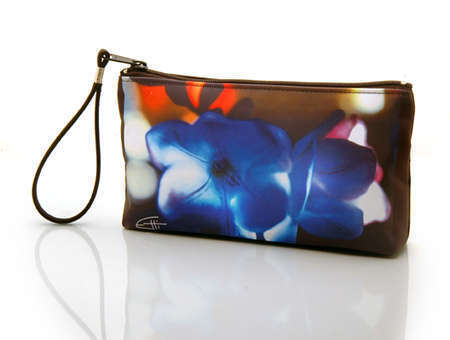 "Blue"
Cosmetic/clutch bag with zipper closure, interior attached key fob   10" x 5.5" x 1.75"- at base 6.5" 