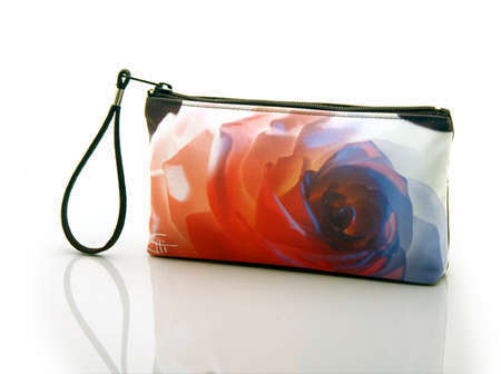 "Electric Rose"
Cosmetic/clutch bag with zipper closure, interior attached key fob   10" x 5.5" x 1.75"- at base 6.5" 