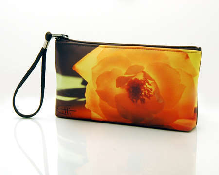 "Enlightened"
Cosmetic/clutch bag with zipper closure, interior attached key fob   10" x 5.5" x 1.75"- at base 6.5" 