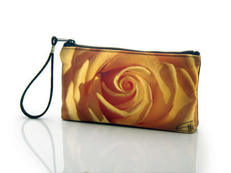 Yellow Rose
Cosmetic/clutch bag with zipper closure, interior attached key fob   10" x 5.5" x 1.75"- at base 6.5" 