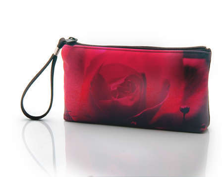 "Night Pink"
Cosmetic/clutch bag with zipper closure, interior attached key fob   10" x 5.5" x 1.75"- at base 6.5" 