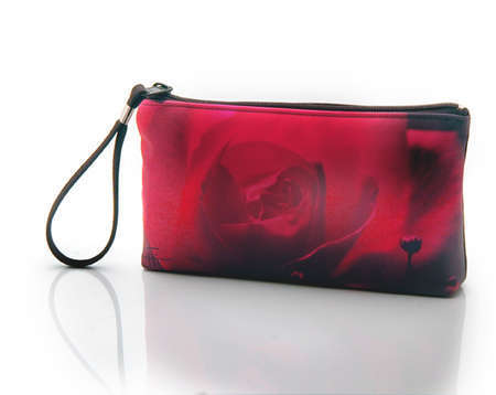 "Night Pink"
Cosmetic/clutch bag with zipper closure, interior attached key fob   10" x 5.5" x 1.75"- at base 6.5" 