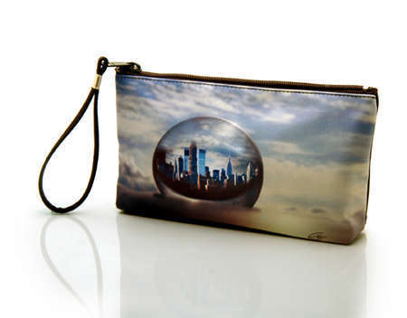 "Planet New York"
Cosmetic/clutch bag with zipper closure, interior attached key fob   10" x 5.5" x 1.75"- at base 6.5" 